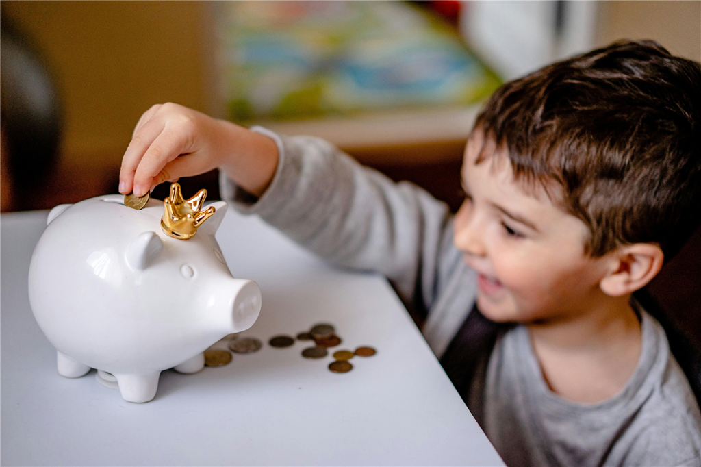 Boy with piggy bank