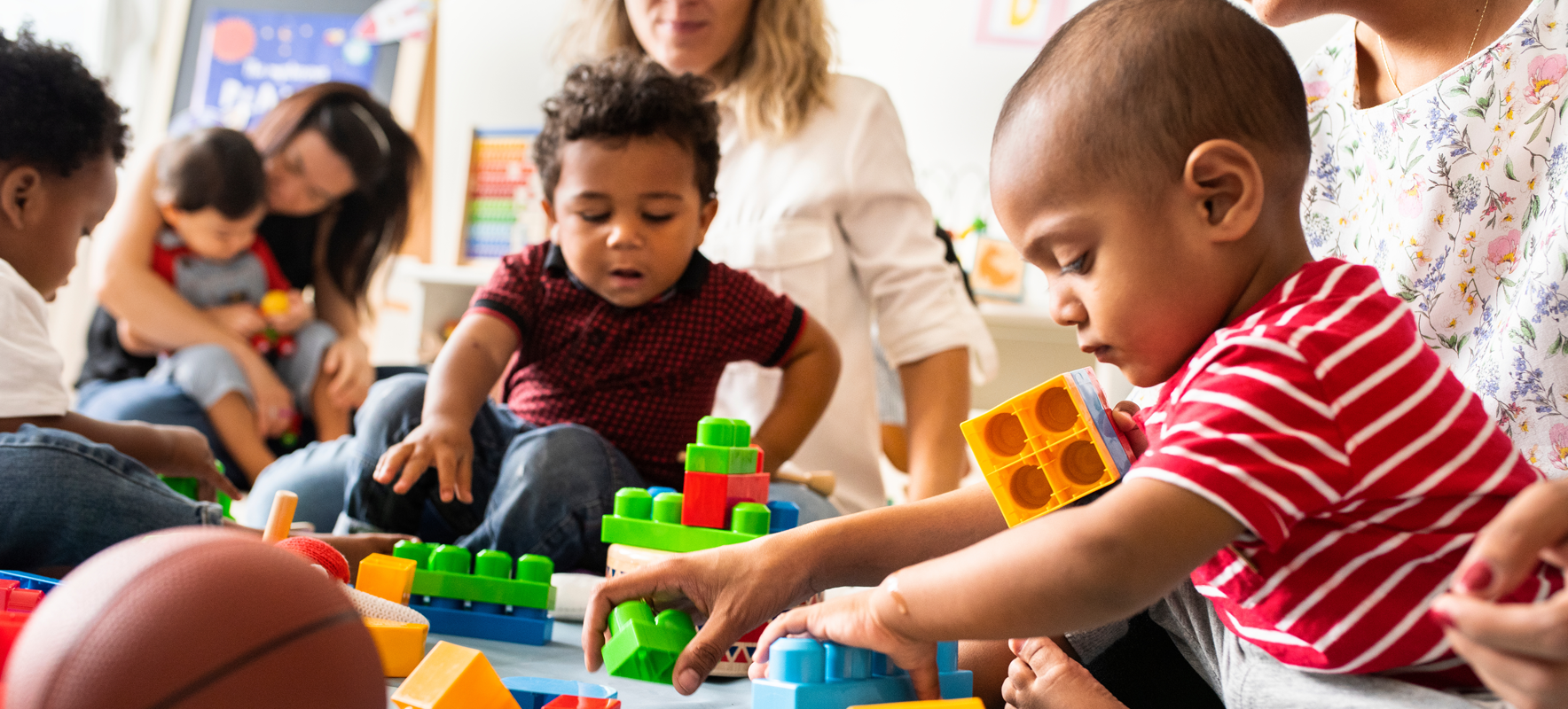 image of mums and toddler group with playing bocks